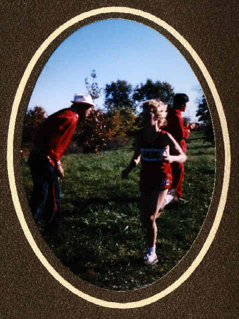 Heidi Page zooms on by as Errol Logue coaches the next runner