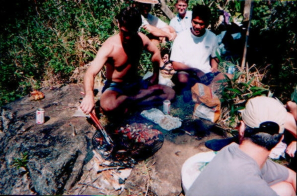 Justin tends the ribs under Sonny's watchful eye